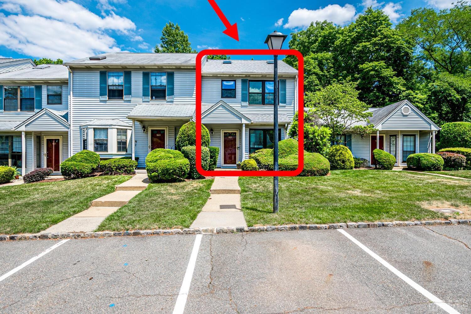 1005 Maplecrest Road Edison, NJ 08820 - Photo 2 of 48 a front view of house with yard and green space