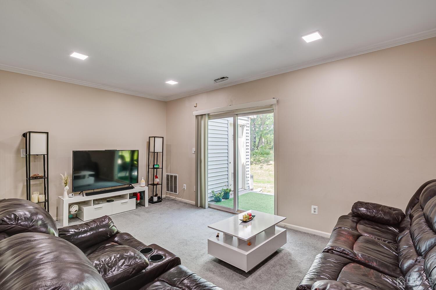 1005 Maplecrest Road Edison, NJ 08820 - Photo 24 of 48 a living room with furniture and a flat screen tv