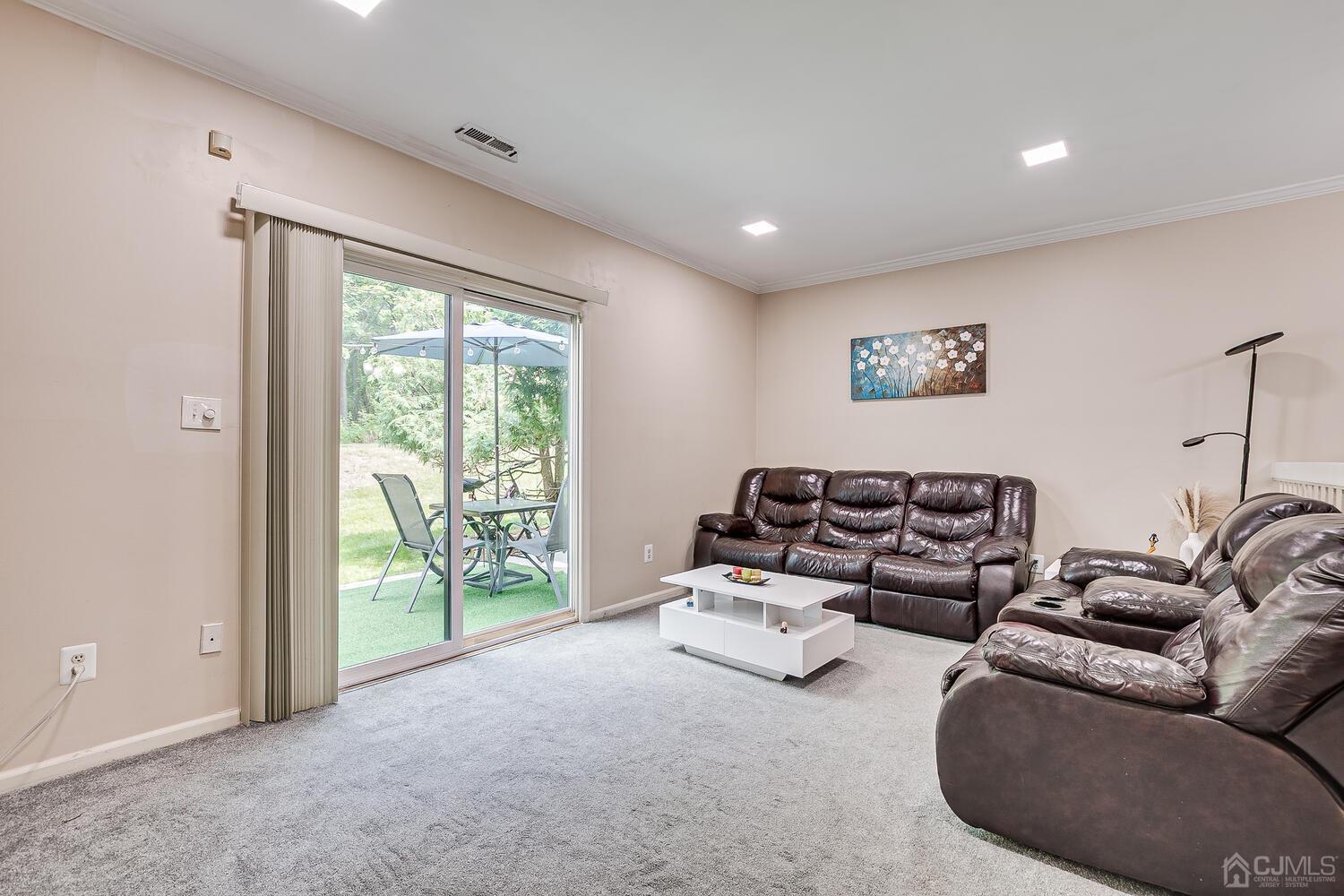 1005 Maplecrest Road Edison, NJ 08820 - Photo 25 of 48 a living room with furniture and a large window