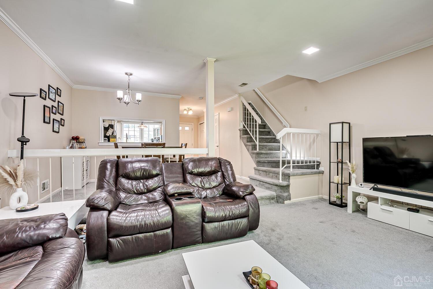 1005 Maplecrest Road Edison, NJ 08820 - Photo 28 of 48 a living room with furniture and a flat screen tv