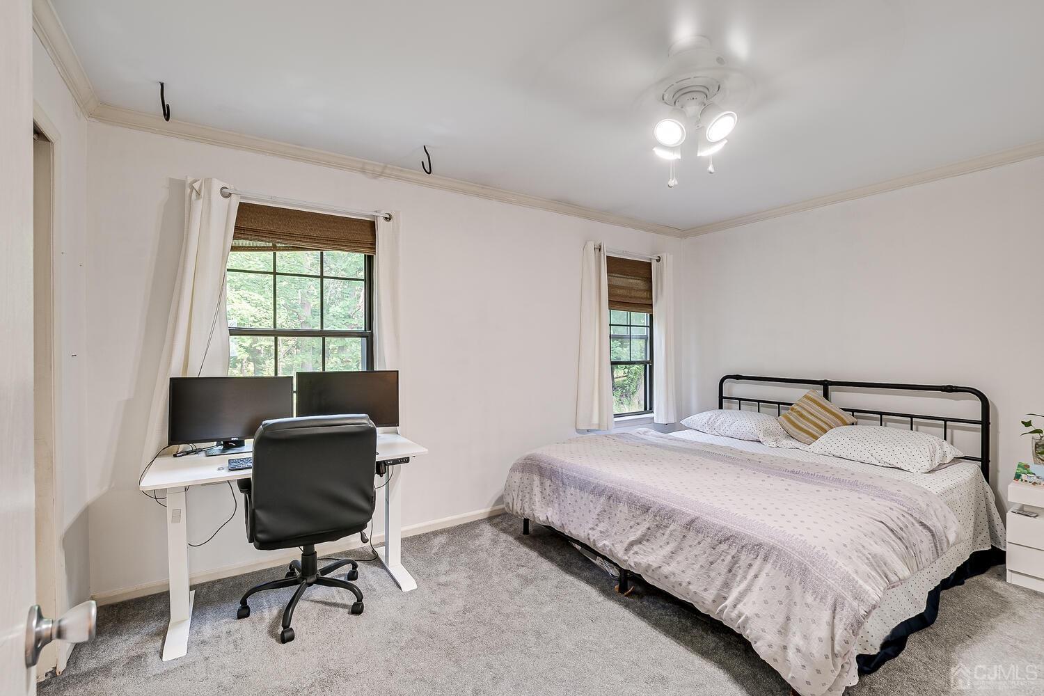 1005 Maplecrest Road Edison, NJ 08820 - Photo 31 of 48 a bedroom with a bed and a desk