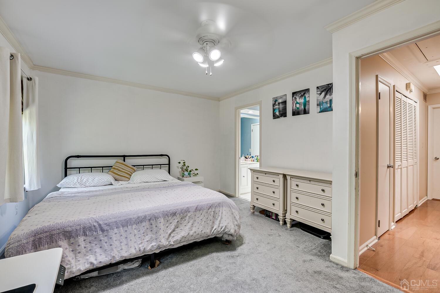 1005 Maplecrest Road Edison, NJ 08820 - Photo 32 of 48 a bedroom with a bed and a cabinets