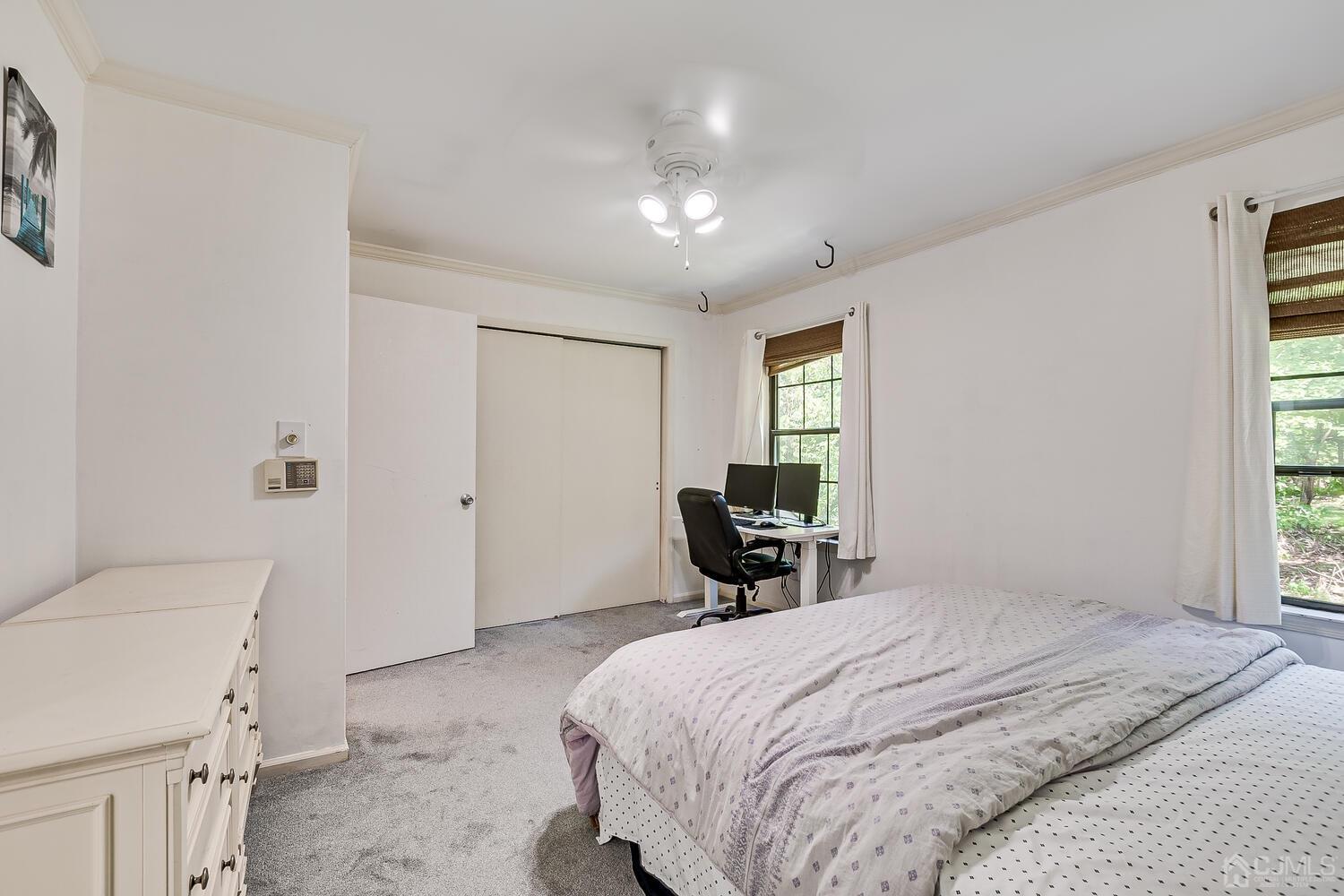 1005 Maplecrest Road Edison, NJ 08820 - Photo 33 of 48 a spacious bedroom with a bed and a tv in it