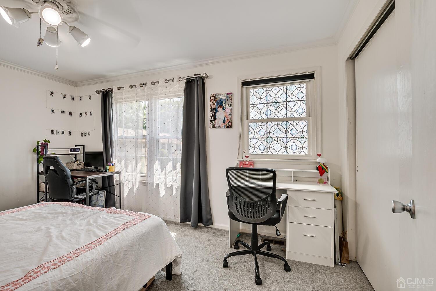 1005 Maplecrest Road Edison, NJ 08820 - Photo 35 of 48 a bedroom that has a bed and a chair in it