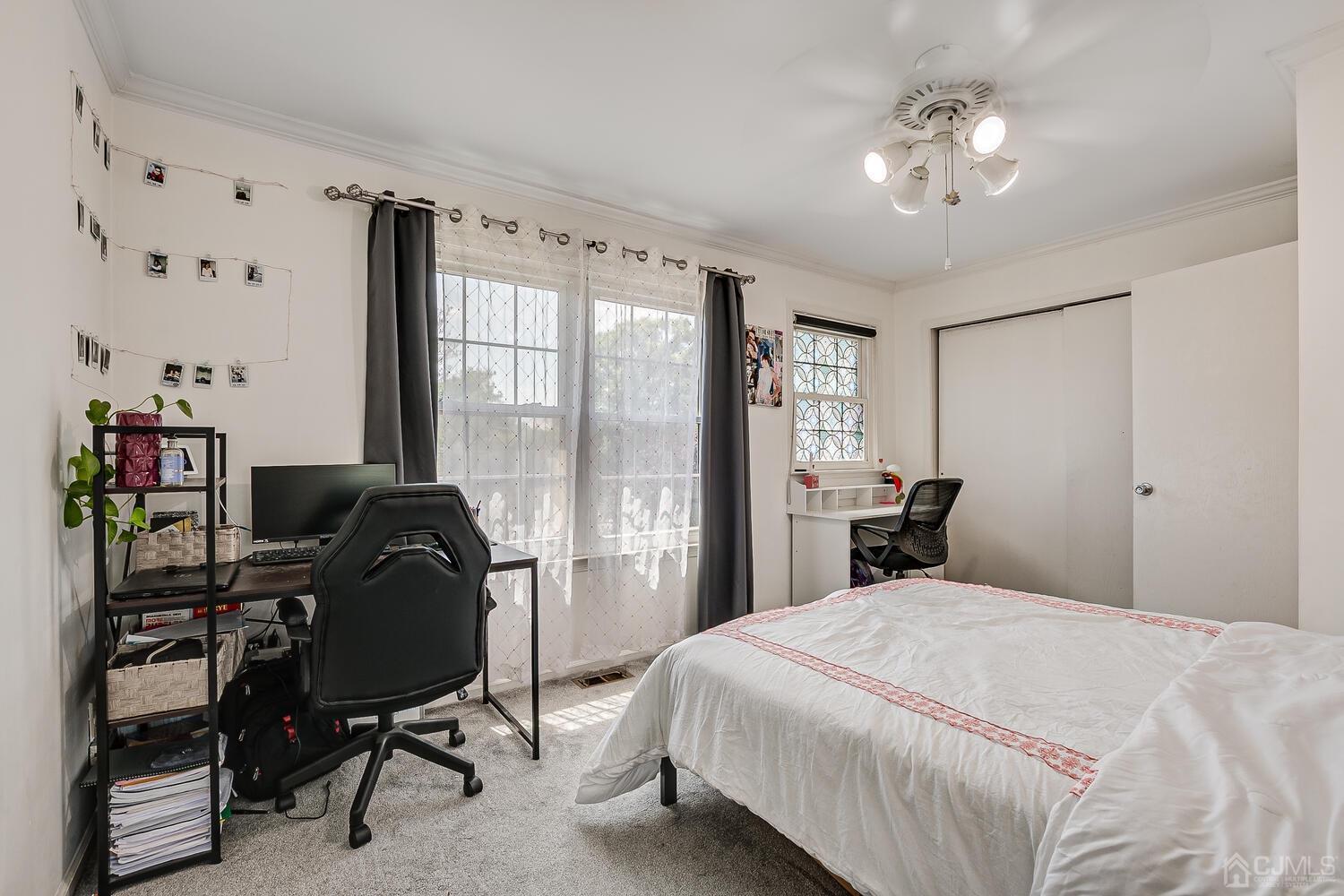 1005 Maplecrest Road Edison, NJ 08820 - Photo 37 of 48 a bedroom with a bed piano and a desk
