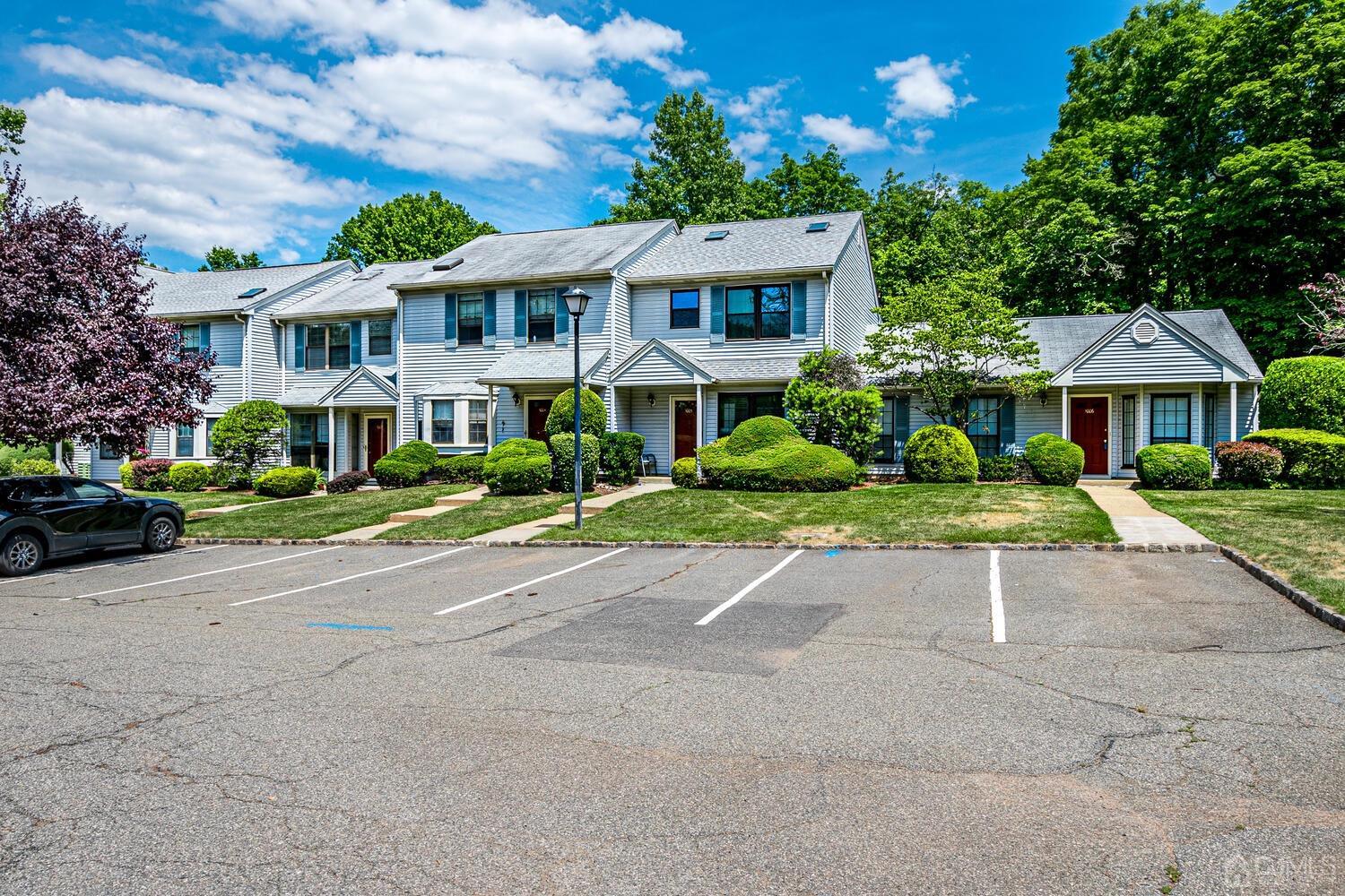 1005 Maplecrest Road Edison, NJ 08820 - Photo 4 of 48 a front view of a house with a yard