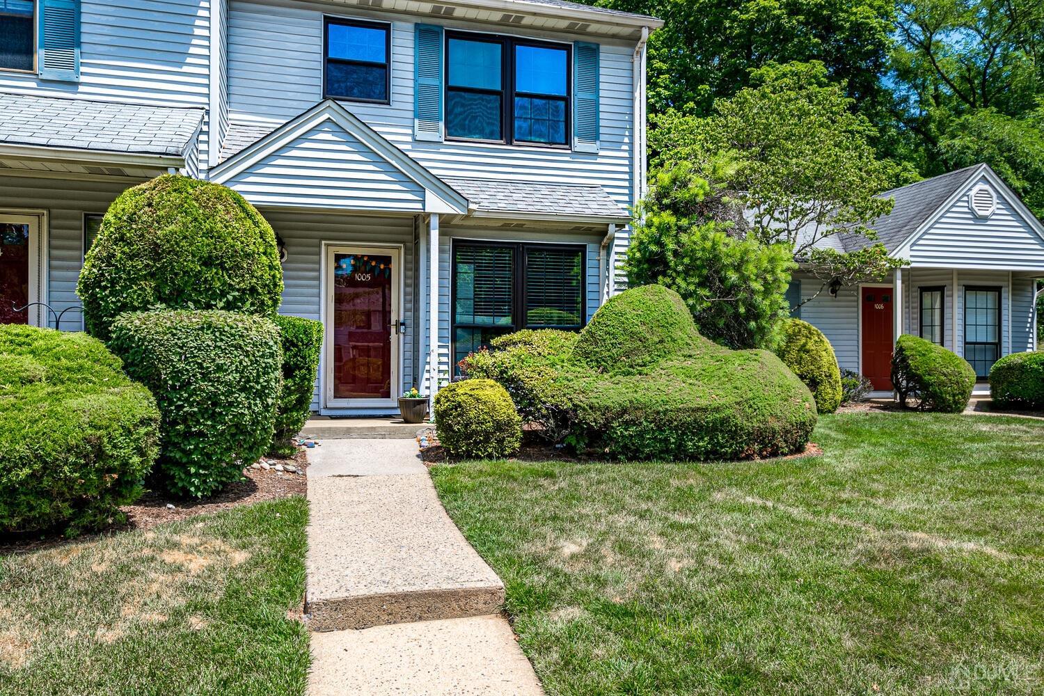 1005 Maplecrest Road Edison, NJ 08820 - Photo 5 of 48 a front view of a house with a garden