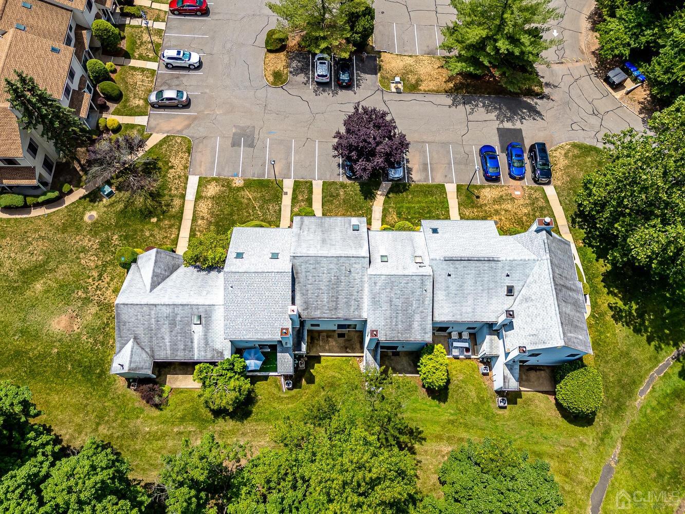 1005 Maplecrest Road Edison, NJ 08820 - Photo 7 of 48 an aerial view of a house with swimming pool and large trees