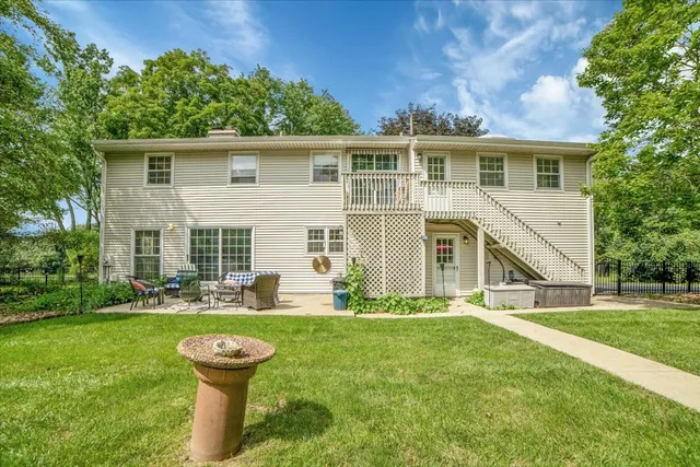 a view of a house with a yard porch and sitting area