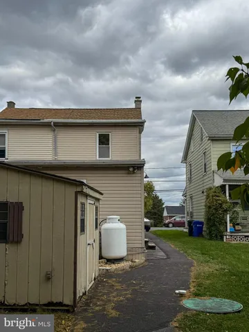 a view of a backyard of the house