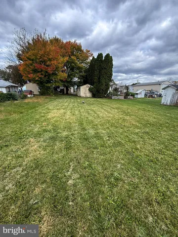 a bathroom with a sink mirror vanity and toilet