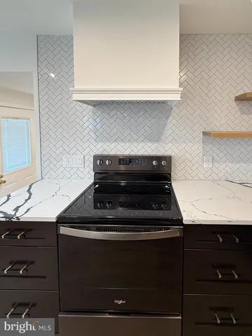 a close view of a stove a sink and dishwasher