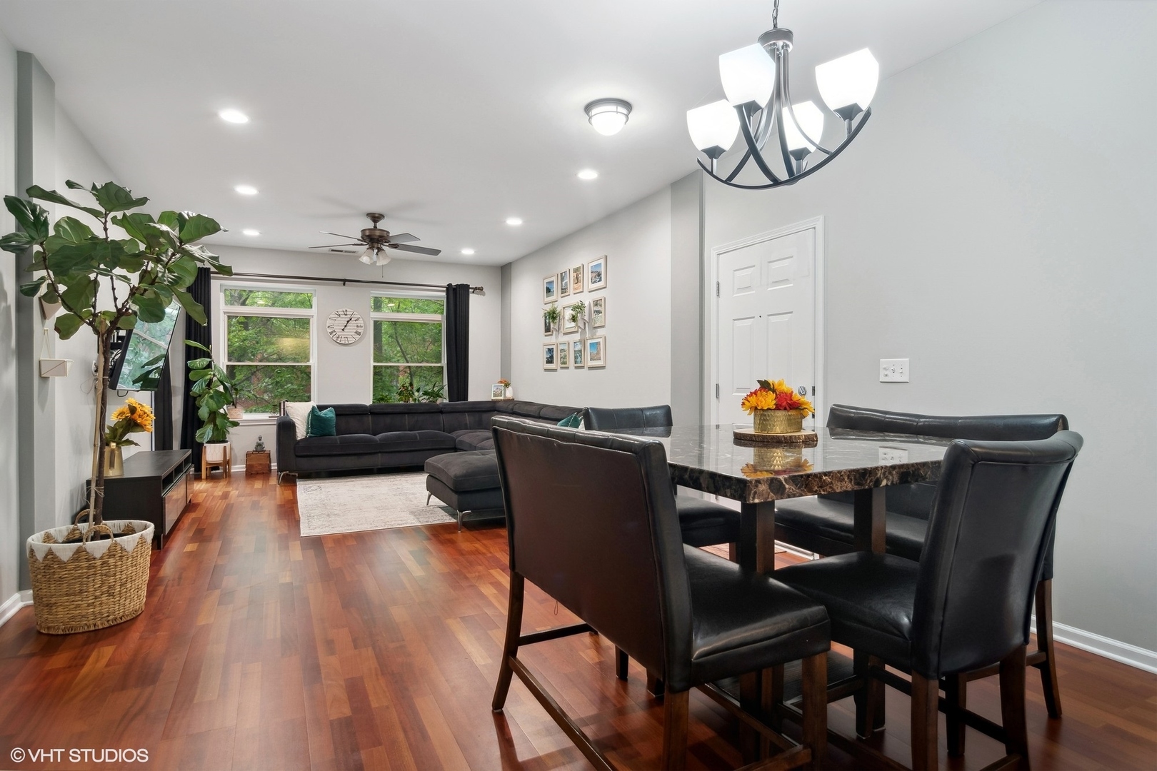 1451 South Halsted Street, Unit 2A Chicago, IL 60607 - Photo 4 of 10 a view of a dining room with furniture wooden floor and chandelier