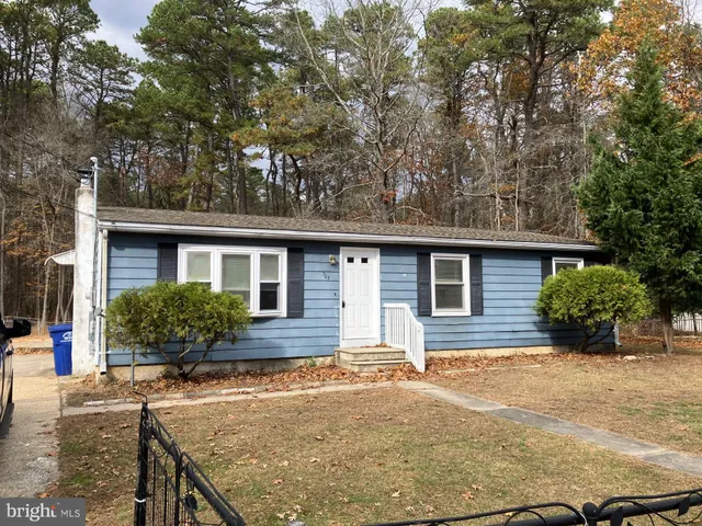 a front view of a house with yard