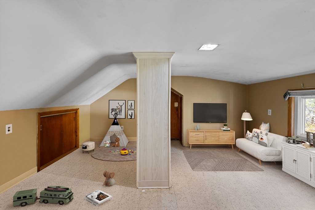 51 Appleton Street Saugus, MA 01906 - Photo 12 of 17 a living room with furniture and a flat screen tv