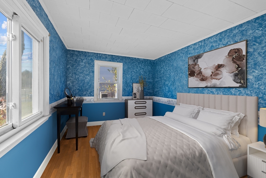 51 Appleton Street Saugus, MA 01906 - Photo 10 of 17 a bedroom with a large bed and a window