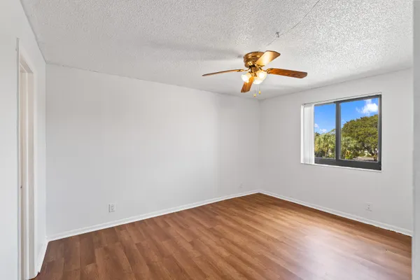 a bathroom with a sink mirror and toilet