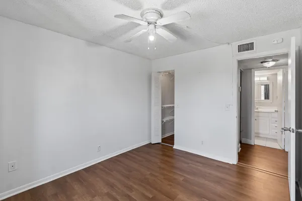 a bathroom with a sink toilet and mirror