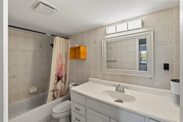 a view of a livingroom with wooden floor