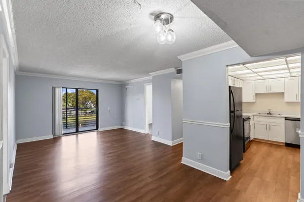 a view of a livingroom with wooden floor
