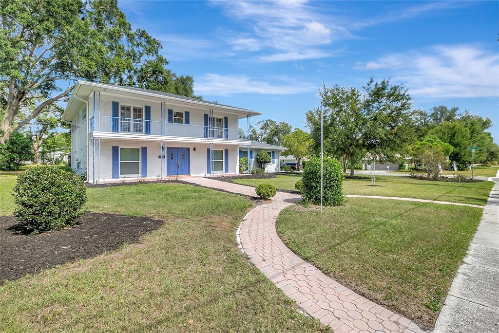 604 Druid Hills Road Temple Terrace, FL 33617 - Photo 2 of 59 front view of a house with a yard