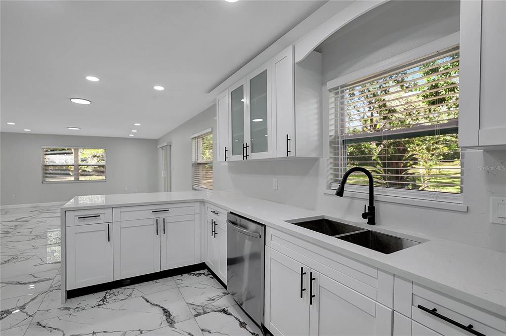 604 Druid Hills Road Temple Terrace, FL 33617 - Photo 21 of 59 a kitchen with a sink cabinets and window