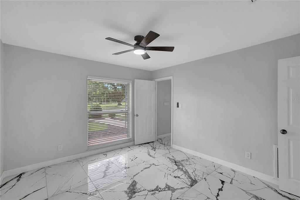 604 Druid Hills Road Temple Terrace, FL 33617 - Photo 25 of 59 a view of an empty room and window