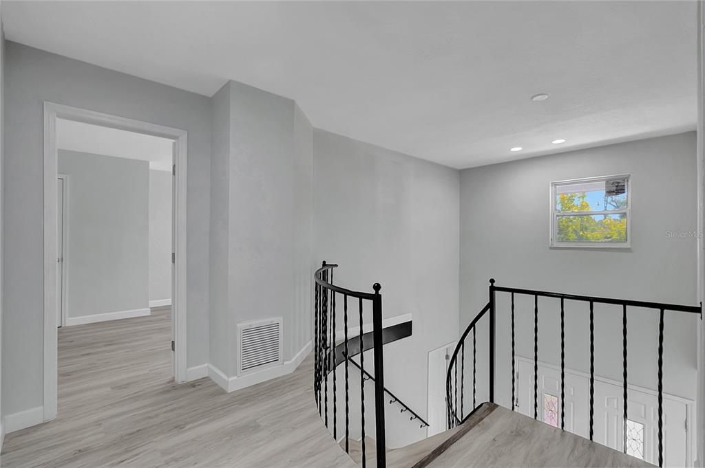 604 Druid Hills Road Temple Terrace, FL 33617 - Photo 29 of 59 a view of staircase with wooden floor and stairs