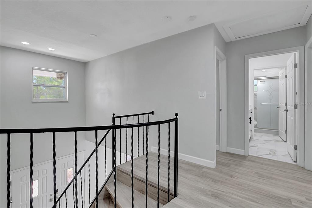 604 Druid Hills Road Temple Terrace, FL 33617 - Photo 30 of 59 a view of a hallway with wooden floor and staircase