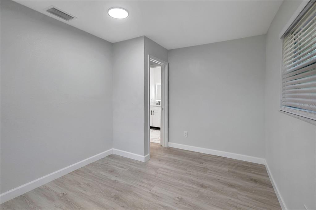 604 Druid Hills Road Temple Terrace, FL 33617 - Photo 39 of 59 wooden floor in an empty room