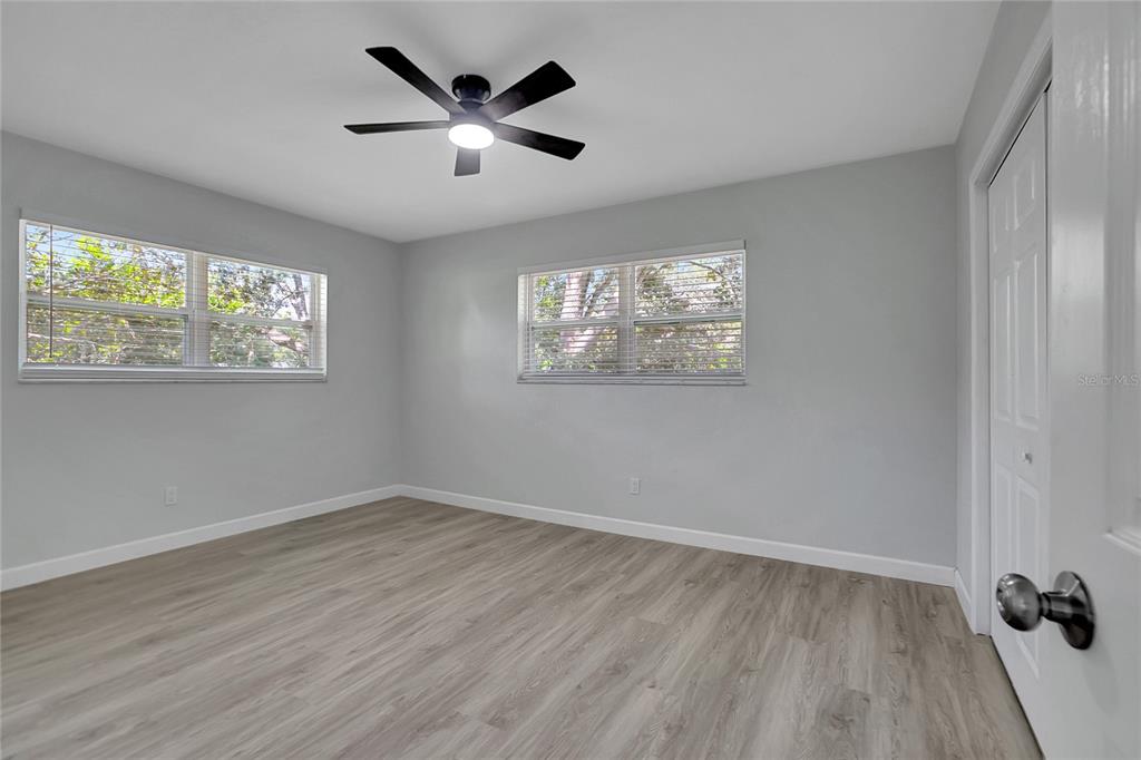 604 Druid Hills Road Temple Terrace, FL 33617 - Photo 42 of 59 a view of empty room with wooden floor and window
