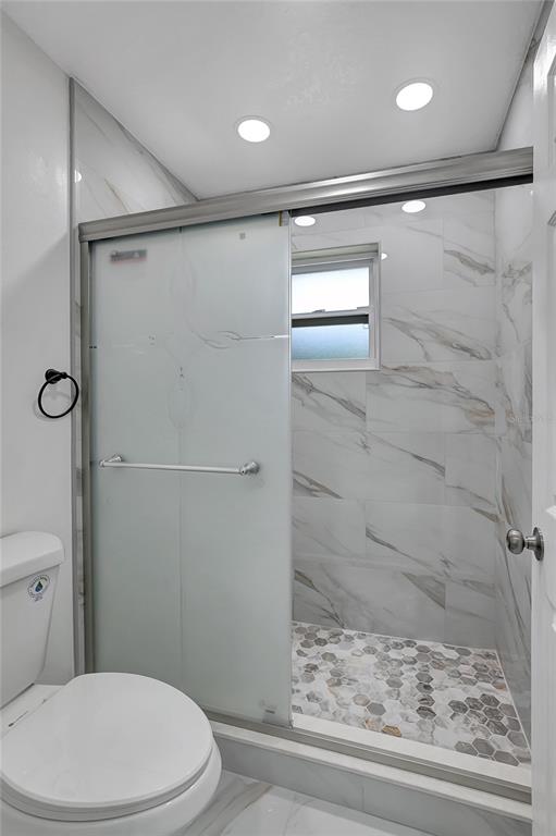 604 Druid Hills Road Temple Terrace, FL 33617 - Photo 45 of 59 a bathroom with a shower and a toilet