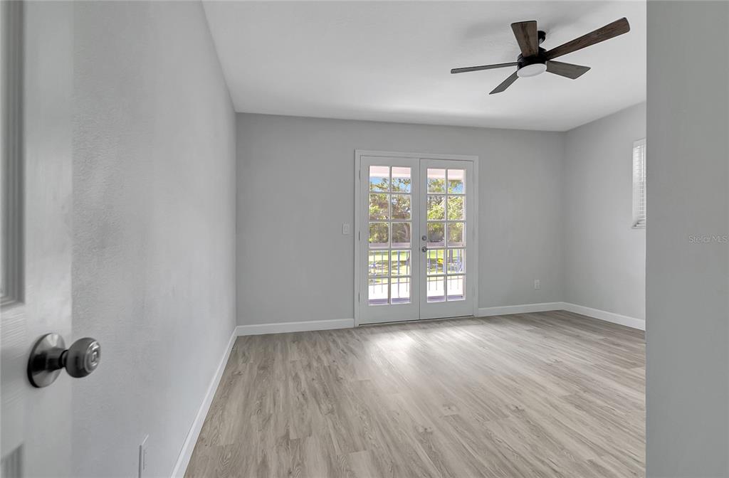 604 Druid Hills Road Temple Terrace, FL 33617 - Photo 46 of 59 wooden floor in an empty room with a window