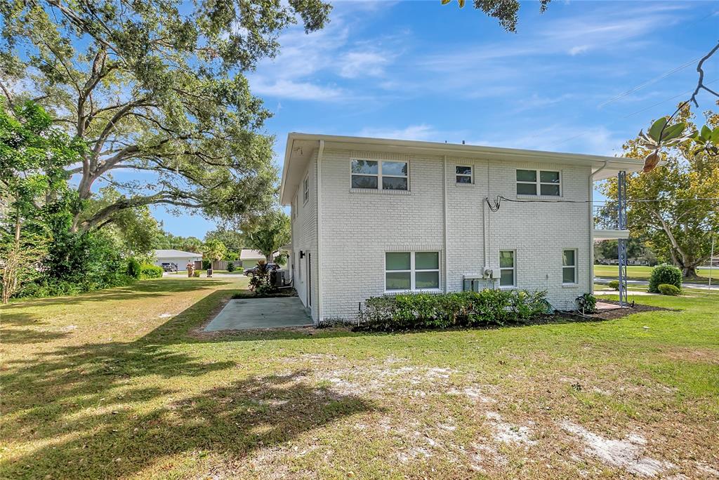604 Druid Hills Road Temple Terrace, FL 33617 - Photo 51 of 59 a front view of a house with garden