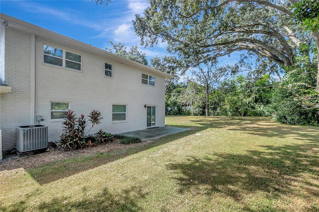 604 Druid Hills Road Temple Terrace, FL 33617 - Photo 53 of 59 a view of backyard of house with green space