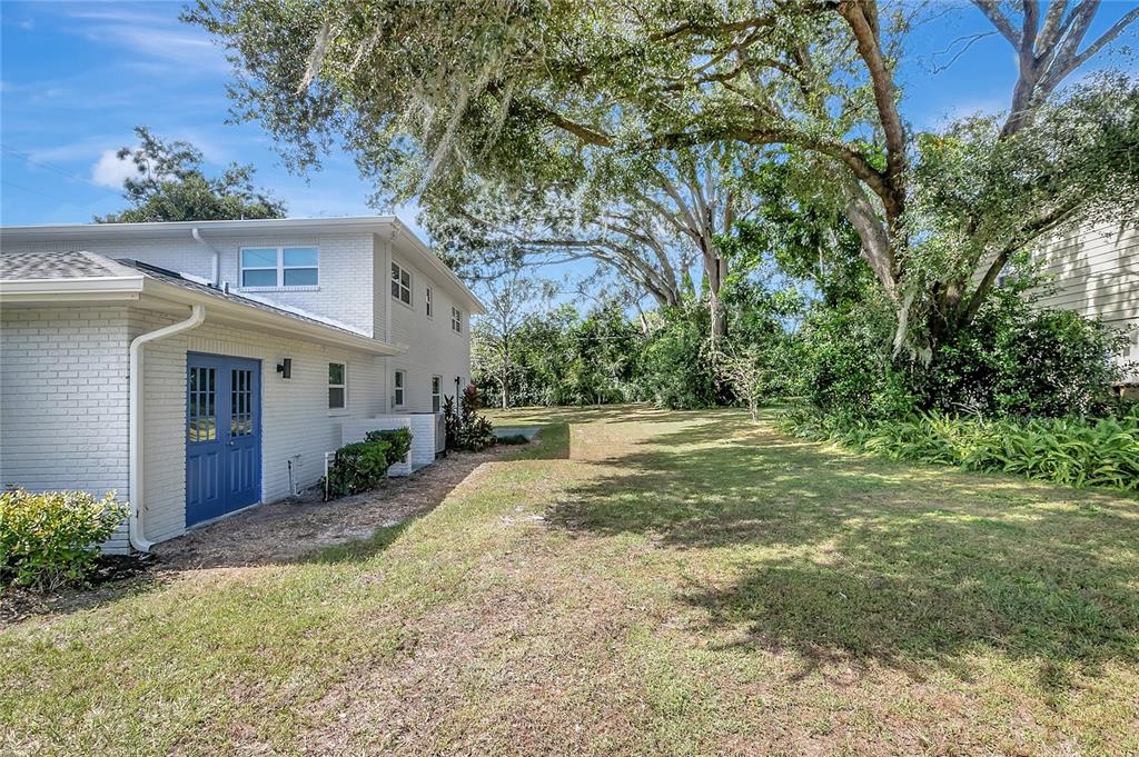604 Druid Hills Road Temple Terrace, FL 33617 - Photo 54 of 59 a view of a house with a yard