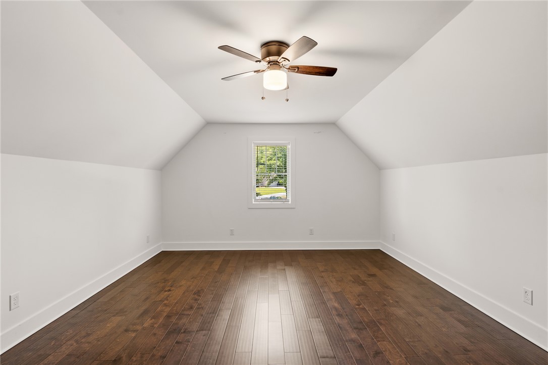 502 Canebrake Drive Anderson, SC 29621 - Photo 33 of 39 This spacious room features vaulted ceilings and rich hardwood flooring, creating an inviting atmosphere.