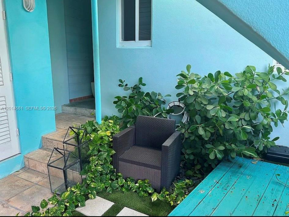 3400 North Surf Road, Unit 1 Hollywood, FL 33019 - Photo 11 of 14 a wooden bench sitting in backside of a house