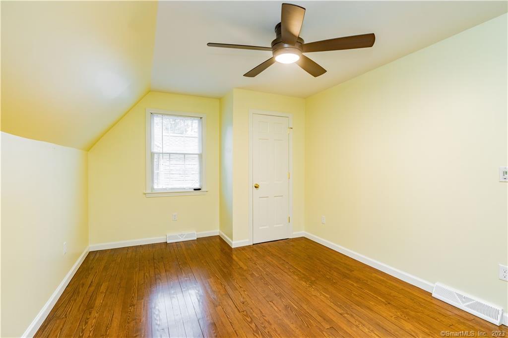 1241 Halladay Avenue West Suffield, CT 06078 - Photo 26 of 29 a view of a room with wooden floor a ceiling fan and window