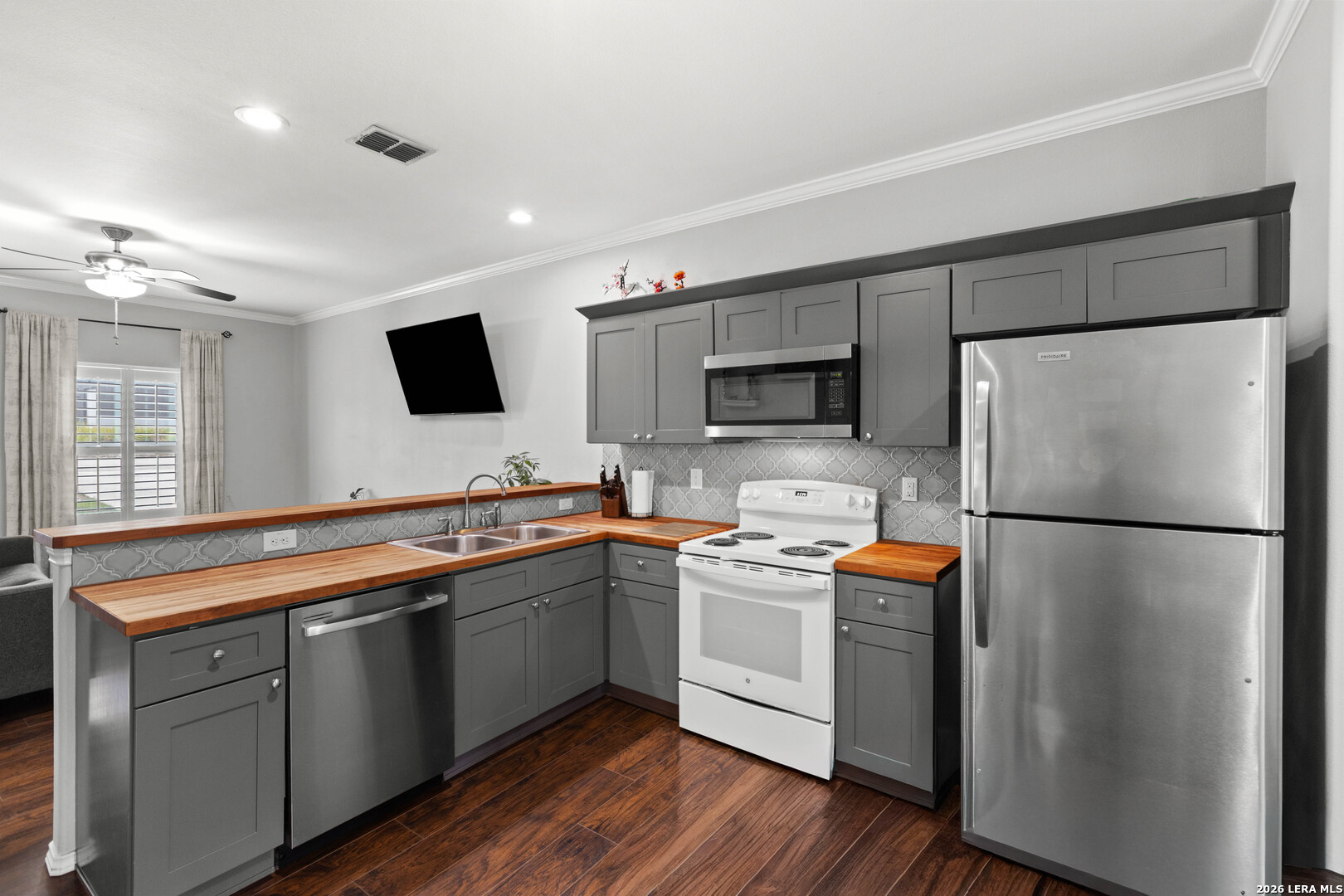 441 Cimarron Spring Branch, TX 78070 - Photo 7 of 20 a kitchen with stainless steel appliances a refrigerator sink and microwave