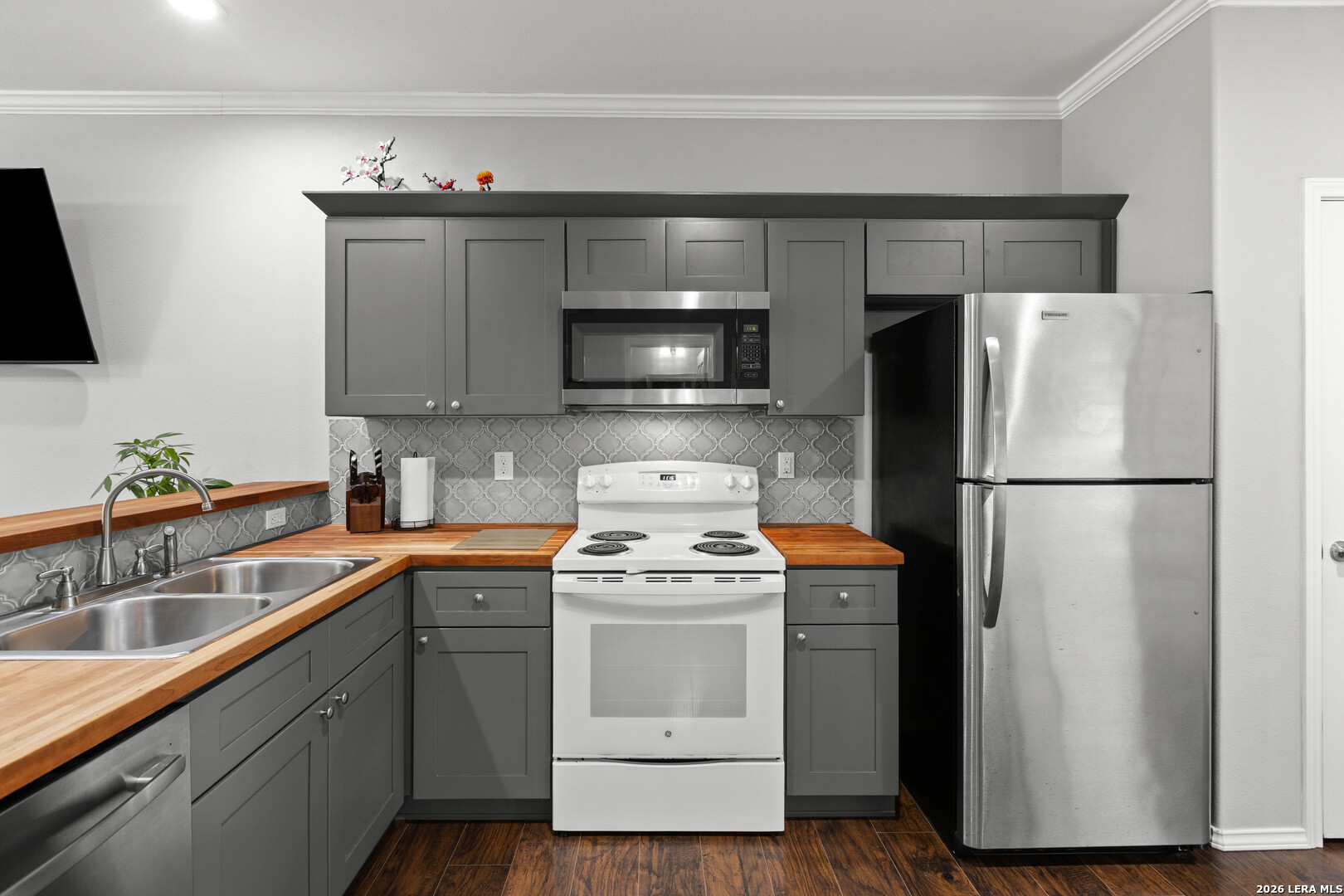 441 Cimarron Spring Branch, TX 78070 - Photo 8 of 20 a kitchen with a refrigerator sink and cabinets