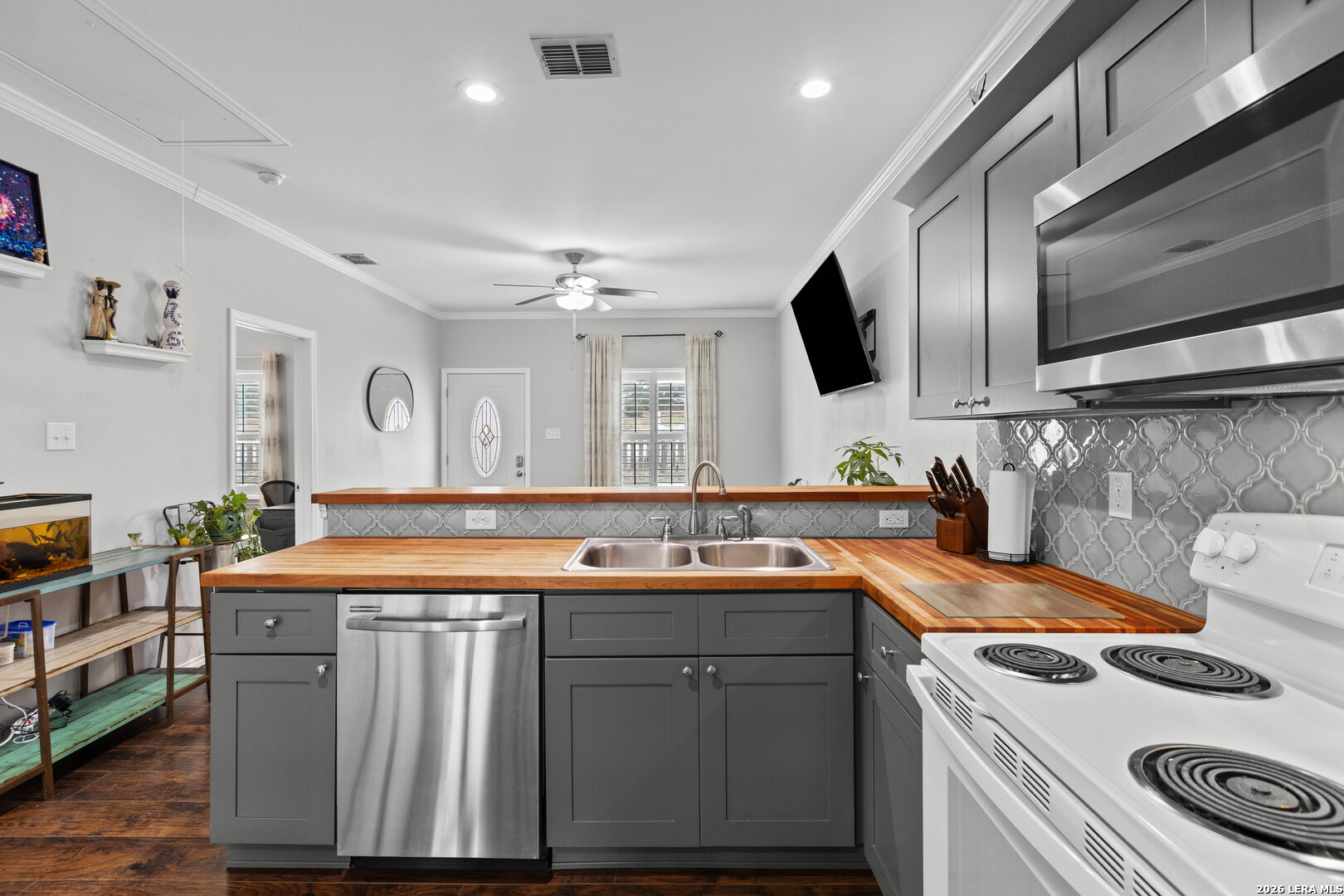 441 Cimarron Spring Branch, TX 78070 - Photo 9 of 20 a kitchen with stainless steel appliances granite countertop a sink stove and cabinets