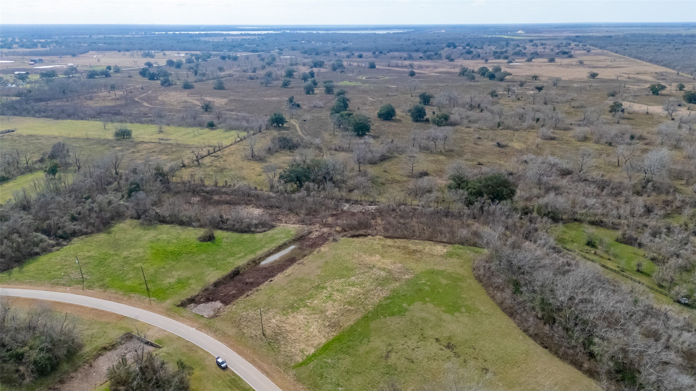 22802 Pittman Drive Angleton, TX 77515 - Photo 4 of 9 Sweeping countryside views surround this 3+ acre homesite, offering privacy, space, and room to design your own retreat.