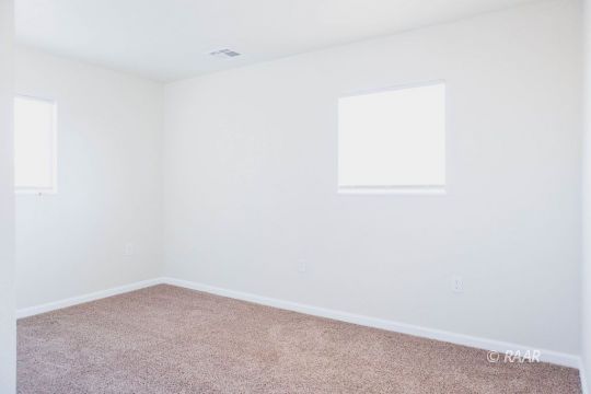 148 South Sunset Street Ridgecrest, CA 93555 - Photo 14 of 25 an empty room with a window