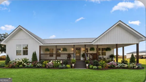front view of a house with a yard