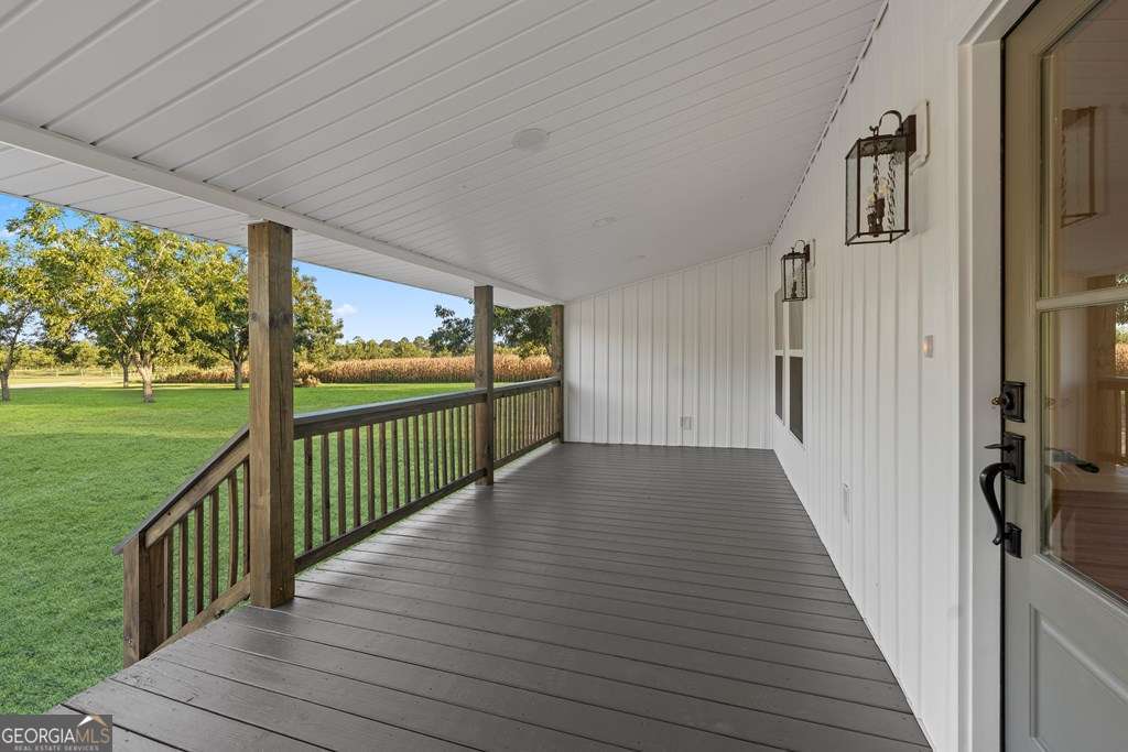 1335 Clifford Loop Blackshear, GA 31516 - Photo 16 of 43 a view of a balcony with wooden floor