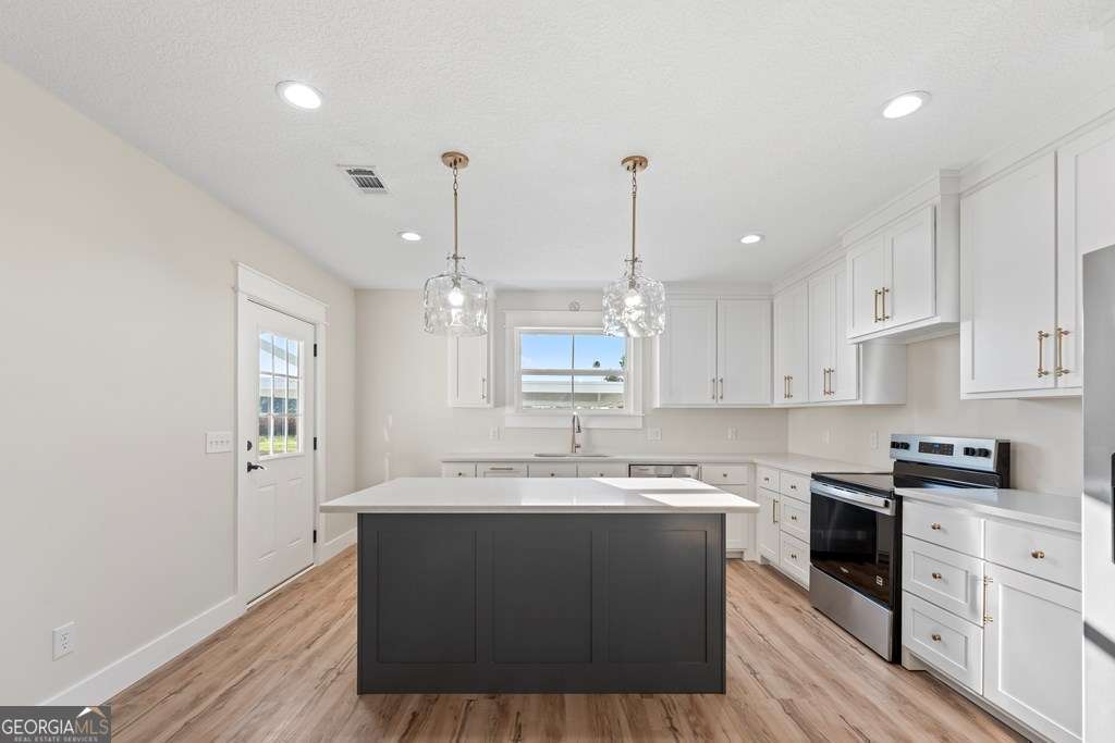 1335 Clifford Loop Blackshear, GA 31516 - Photo 24 of 43 a kitchen with a sink cabinets and window