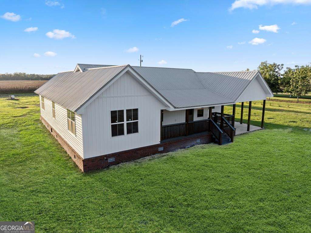 1335 Clifford Loop Blackshear, GA 31516 - Photo 3 of 43 a house view with a garden space