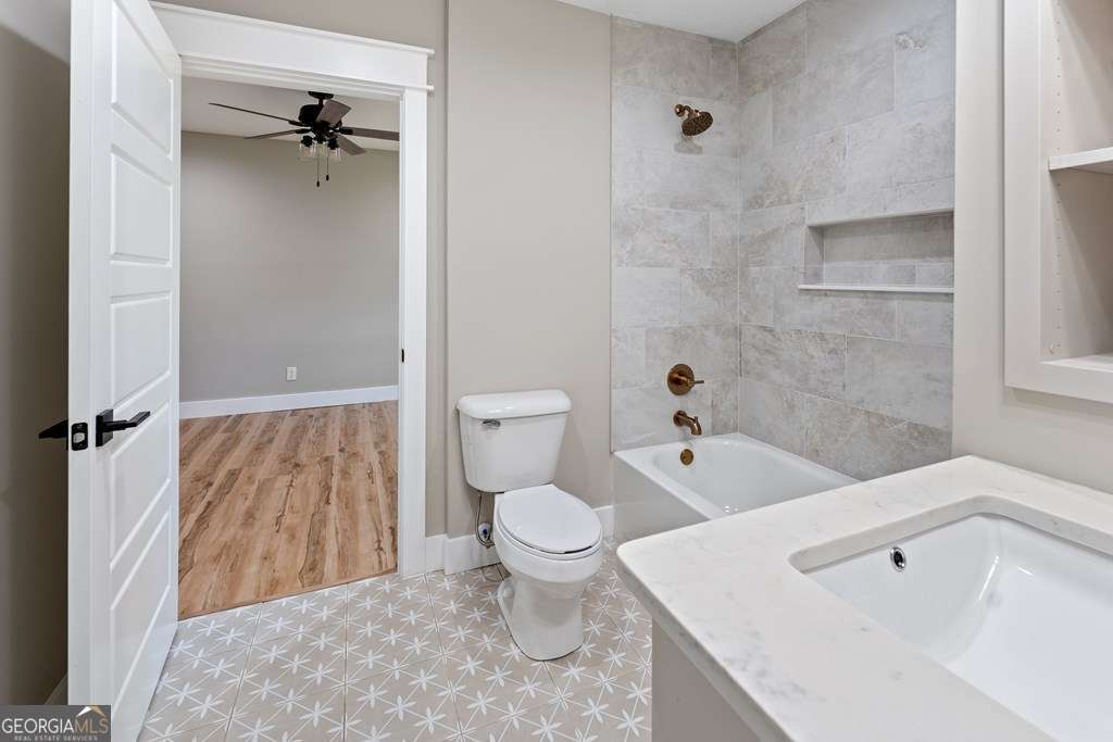 1335 Clifford Loop Blackshear, GA 31516 - Photo 32 of 43 a bathroom with a toilet and a tub