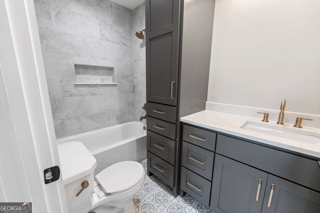 1335 Clifford Loop Blackshear, GA 31516 - Photo 37 of 43 a bathroom with a sink a toilet and shower